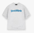 A light heather gray oversized t-shirt with 'Doolittle's' printed across the chest in a blue bubbly font, displayed on a clean white background.